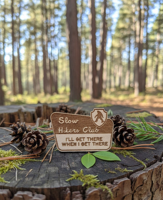 Slow Hikers Club Wooden Lapel Pin – “I’ll Get There When I Get There” Hiking Badge for Nature Lovers & Trail Humor Fans